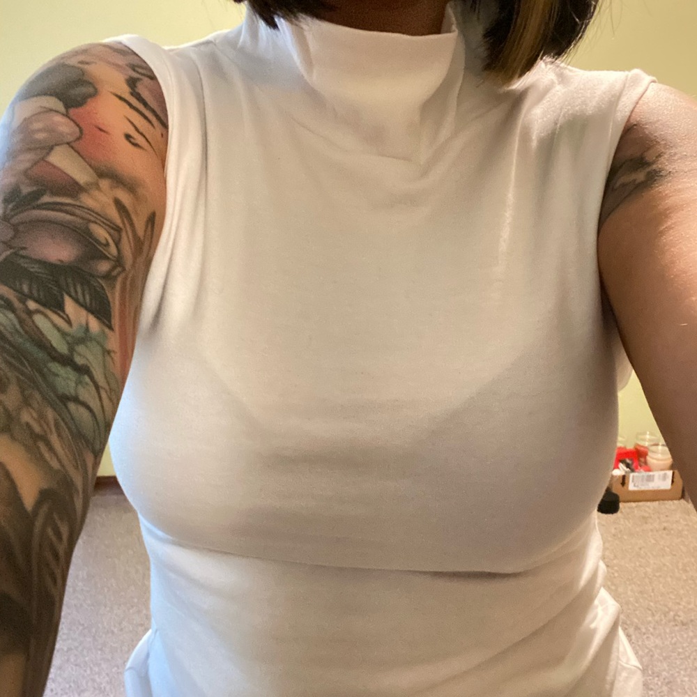 White sleeveless turtleneck